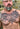 Script tattoo on the chest reading Strength and honour done at Sacred Gold Tattoo in London