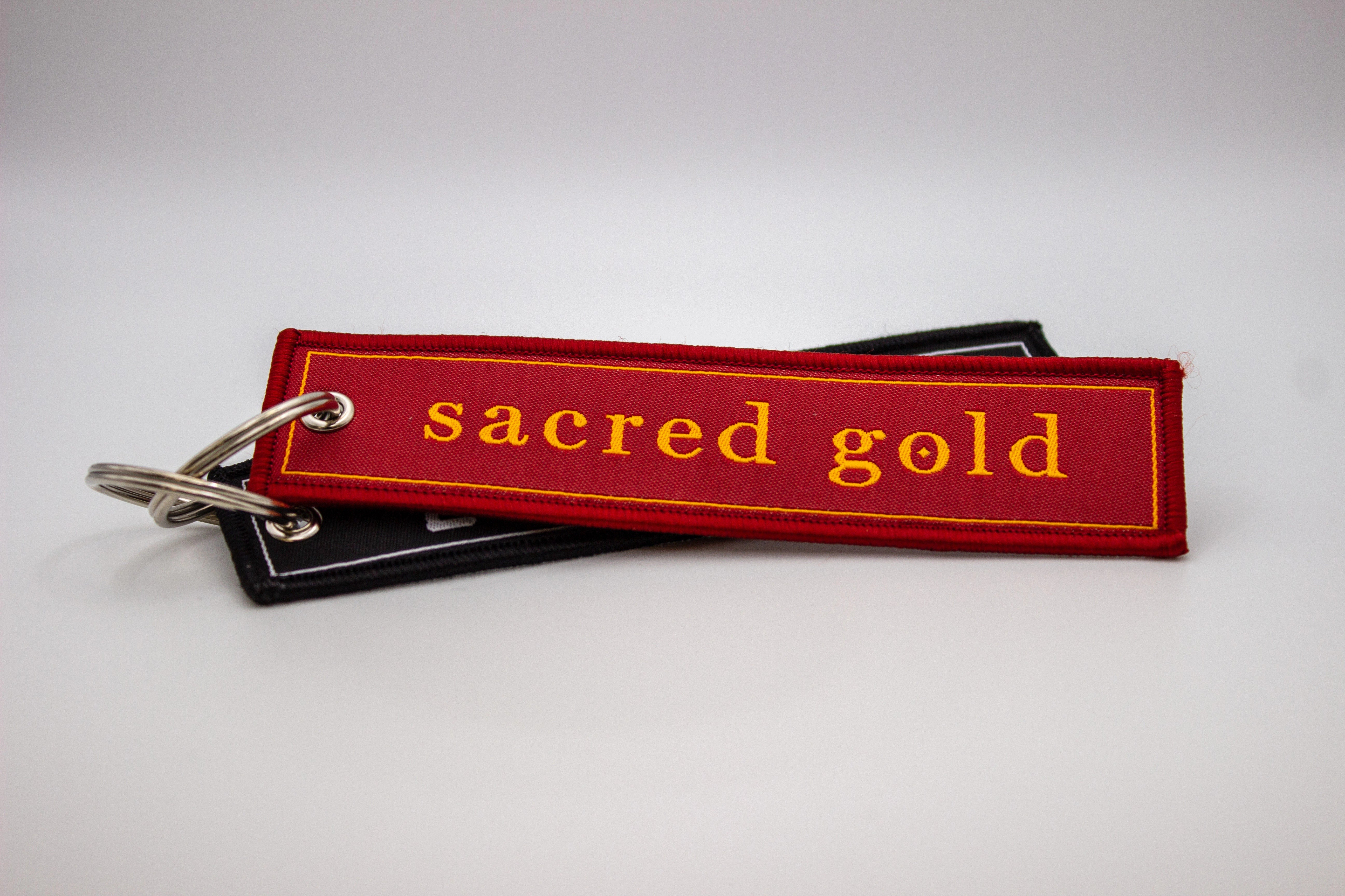 Front view Sacred Gold keyrings
