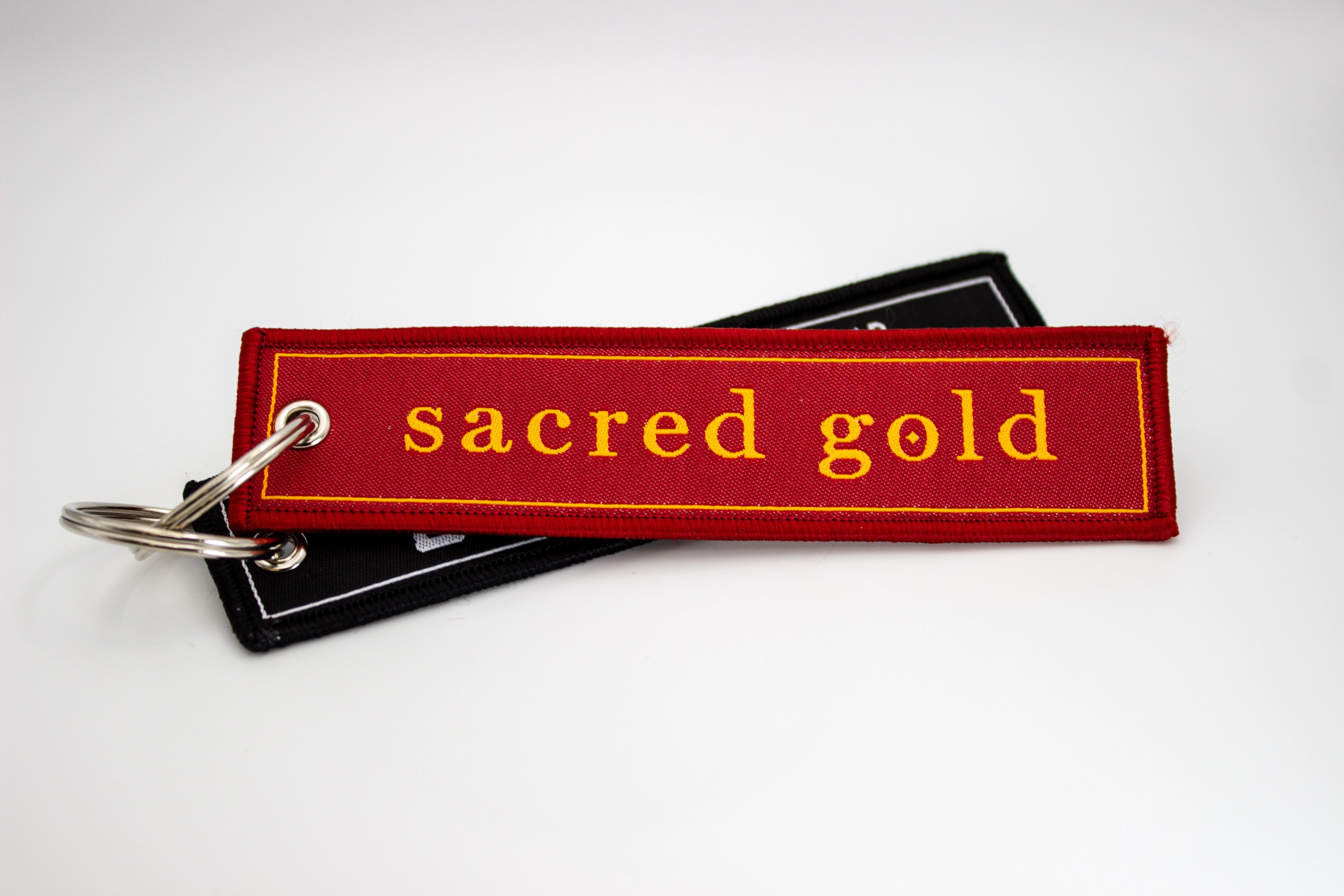 Close up Sacred Gold keyrings 